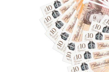 10 İngiliz sterlinli banknotlar beyaz arka planda fotokopi alanı ile izole edilmiş. Zengin yaşam kavramsal geçmişi. Büyük miktarda ulusal para birimi zenginliği