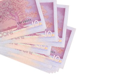 10 Estonya kroon banknotu küçük gruplar halinde ya da beyaza izole edilmiş paketler halinde yatar. Kopyalama alanı olan bir model. İş ve para değişimi kavramı