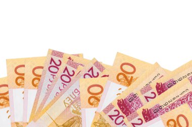 Ekranın alt tarafında 20 Belorus rublesi banknotu var. Beyaz arka planda izole edilmiş ve fotokopi alanı var. Paralı iş kavramları için arkaplan afişi şablonu