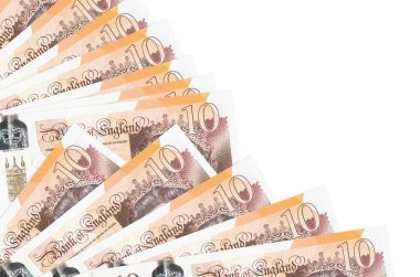 10 İngiliz sterlinli banknotlar beyaz arka planda izole edilmiş, fotokopi alanı da pervaneye yakın duruyor. Maaş zamanı kavramı veya finansal işlemler