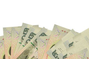 Ekranın alt tarafında 20 Tayland Baht banknotu var. Beyaz arka planda izole edilmiş ve fotokopi alanı var. Paralı iş kavramları için arkaplan afişi şablonu