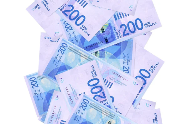 200 İsrailli yeni şekel banknot beyazın üzerinde izole bir şekilde uçuyor. Birçok banknot sol ve sağ tarafta beyaz kopya alanı ile düşüyor