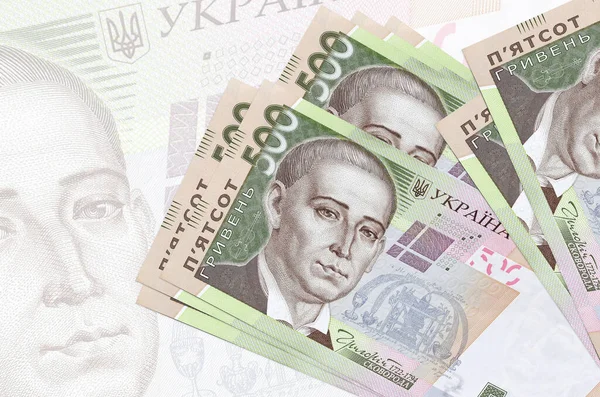500份乌克兰格里夫尼亚钞票在半透明的大钞票的背景下堆积起来 国家货币的摘要列报 业务概念 — 图库照片