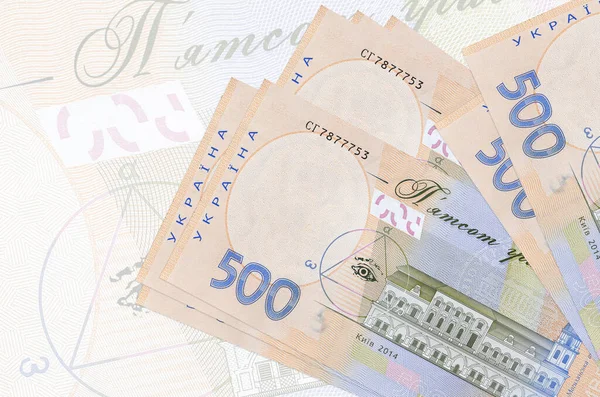 500份乌克兰格里夫尼亚钞票在半透明的大钞票的背景下堆积起来 国家货币的摘要列报 业务概念 — 图库照片