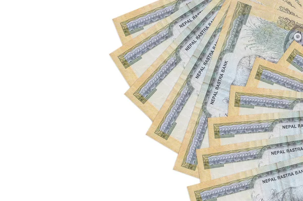100 Nepal Rupisi banknotları beyaz arka planda fotokopi alanı ile izole bir şekilde duruyor. Zengin yaşam kavramsal geçmişi. Büyük miktarda ulusal para birimi zenginliği