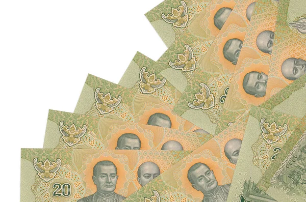 20 Tayland Baht banknotu beyaza izole edilmiş farklı bir sırayla yatar. Yerel bankacılık ya da para kazanma konsepti. İş arkaplanı afişi
