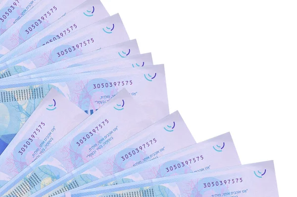 200 İsrailli yeni şekel banknot beyaz arka planda izole bir şekilde duruyor. Fan kaplamasında da kopya alanı var. Maaş zamanı kavramı veya finansal işlemler