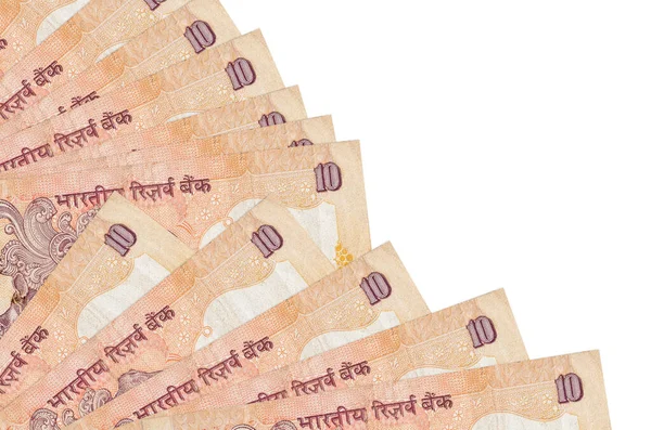 10のインドのルピー札は白い背景に孤立しており ファンの近くにコピースペースが積み上げられています 給料日時間の概念又は金融業務 — ストック写真