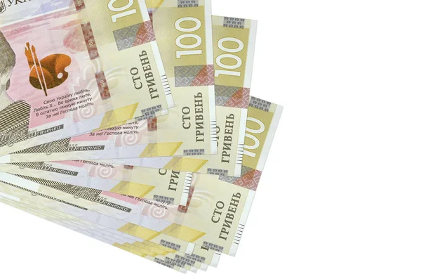 100 Ukrayna hrivniası banknotları küçük gruplar halinde ya da beyazın üzerine izole edilmiş paketler halinde yatar. Kopyalama alanı olan bir model. İş ve para değişimi kavramı