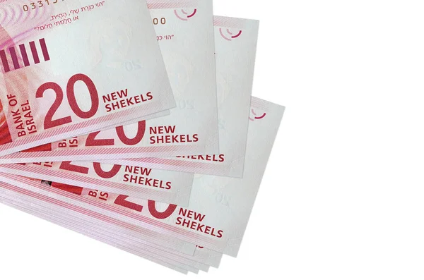 20 İsrailli yeni şekel banknotlar küçük gruplar halinde ya da beyaza izole edilmiş paketler halinde yatıyor. Kopyalama alanı olan bir model. İş ve para değişimi kavramı
