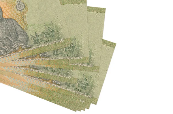 20 Tayland Baht banknotları küçük gruplar halinde ya da beyaz paketler halinde uzanıyor. Kopyalama alanı olan bir model. İş ve para değişimi kavramı