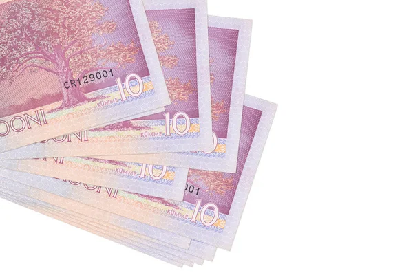 10 Estonya kroon banknotu küçük gruplar halinde ya da beyaza izole edilmiş paketler halinde yatar. Kopyalama alanı olan bir model. İş ve para değişimi kavramı