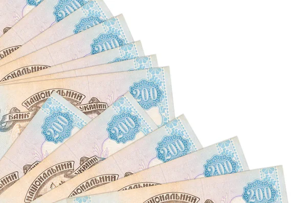 200 Ukrayna hrivniası banknotları beyaz arka planda izole edilmiş, fotokopi alanı da pervaneye yakın duruyor. Maaş zamanı kavramı veya finansal işlemler