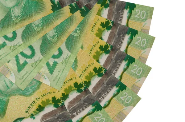 20 Kanada Doları beyaz arka planda izole bir şekilde duruyor. Fan şeklinde fotokopi alanı da yakın planda. Finansal işlemler kavramı