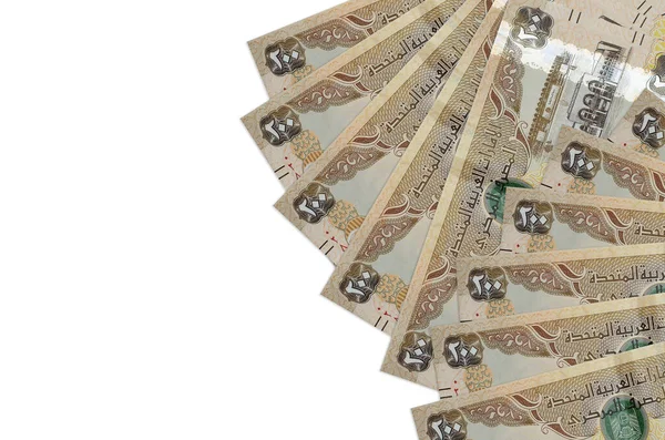 200 BAE dirhem banknotu, kopyalama alanı olan beyaz arkaplanda izole bir şekilde yatıyor. Zengin yaşam kavramsal geçmişi. Büyük miktarda ulusal para birimi zenginliği