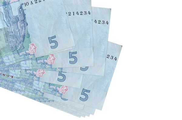 5 Ukrayna hrivniası banknotları küçük gruplar halinde ya da beyazın üzerine izole edilmiş paketler halinde yatar. Kopyalama alanı olan bir model. İş ve para değişimi kavramı