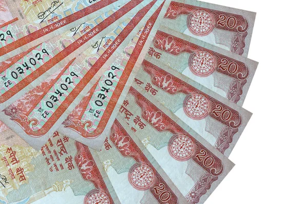 20 Nepal Rupisi banknotları beyaz arka planda izole edilmiş, fotokopi alanı da yakın planda. Finansal işlemler kavramı