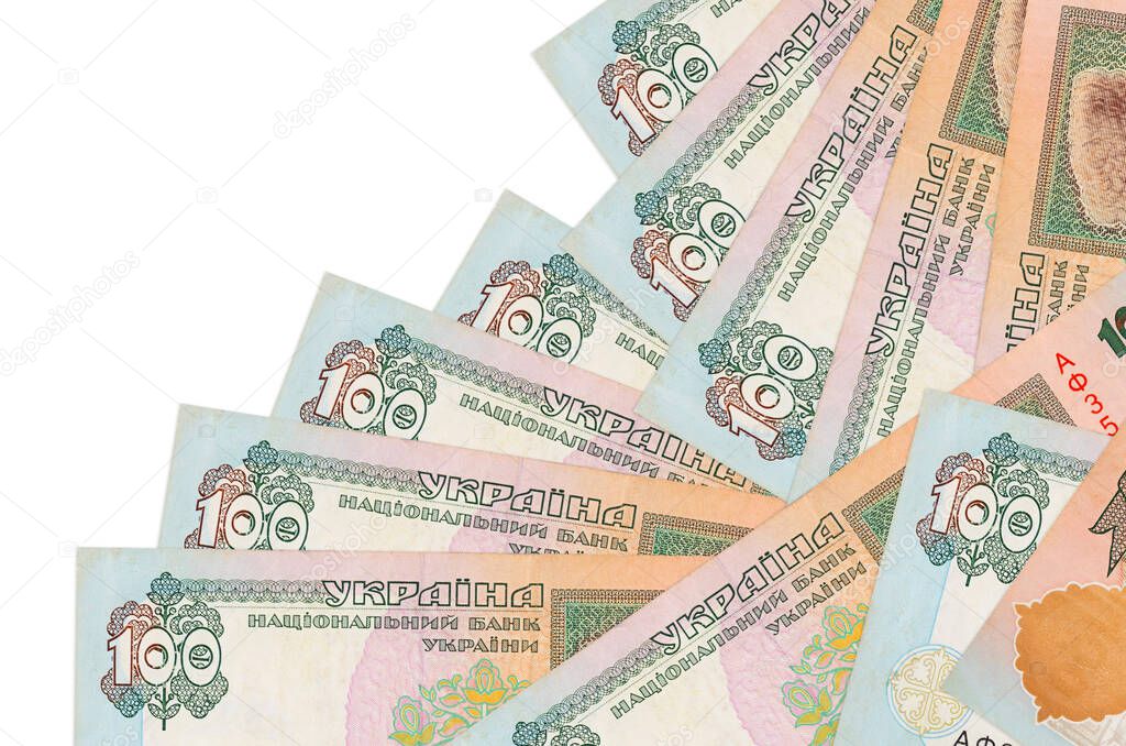 100 Ukrainian hryvnias bills lies in different order isolated on white. Local banking or money making concept. Business background banner