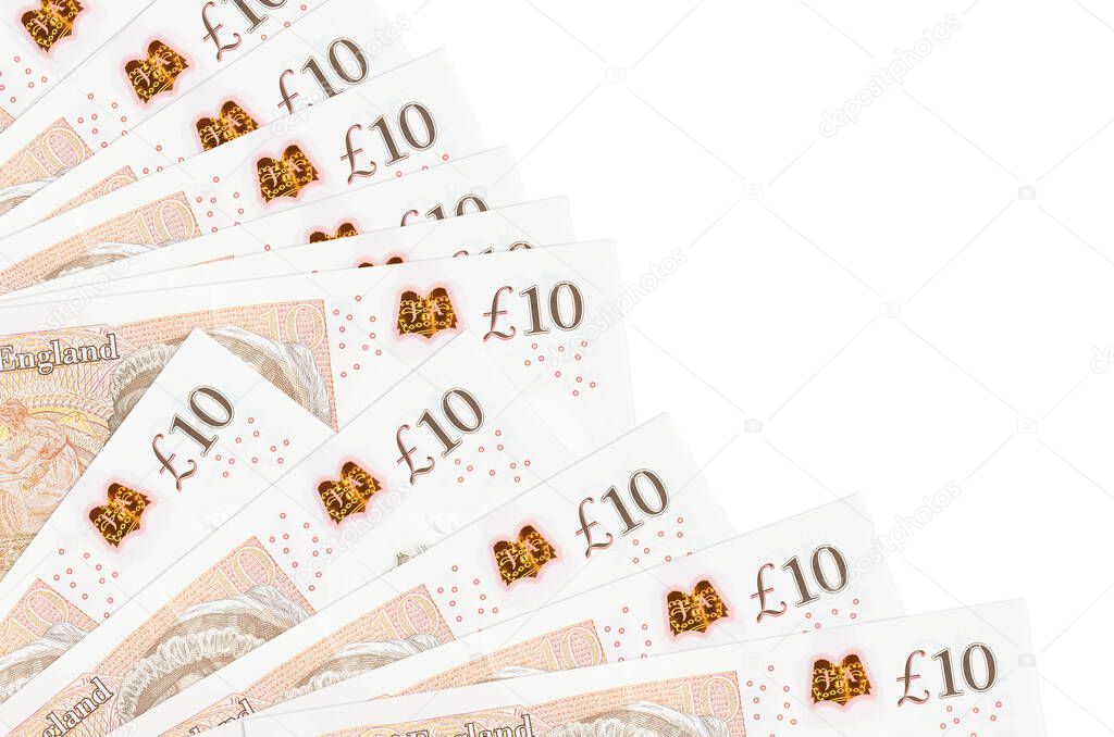 10 British pounds bills lies isolated on white background with copy space stacked in fan close up. Payday time concept or financial operations