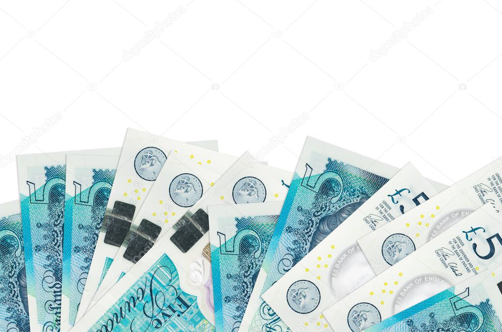 5 British pounds bills lies on bottom side of screen isolated on white background with copy space. Background banner template for business concepts with money