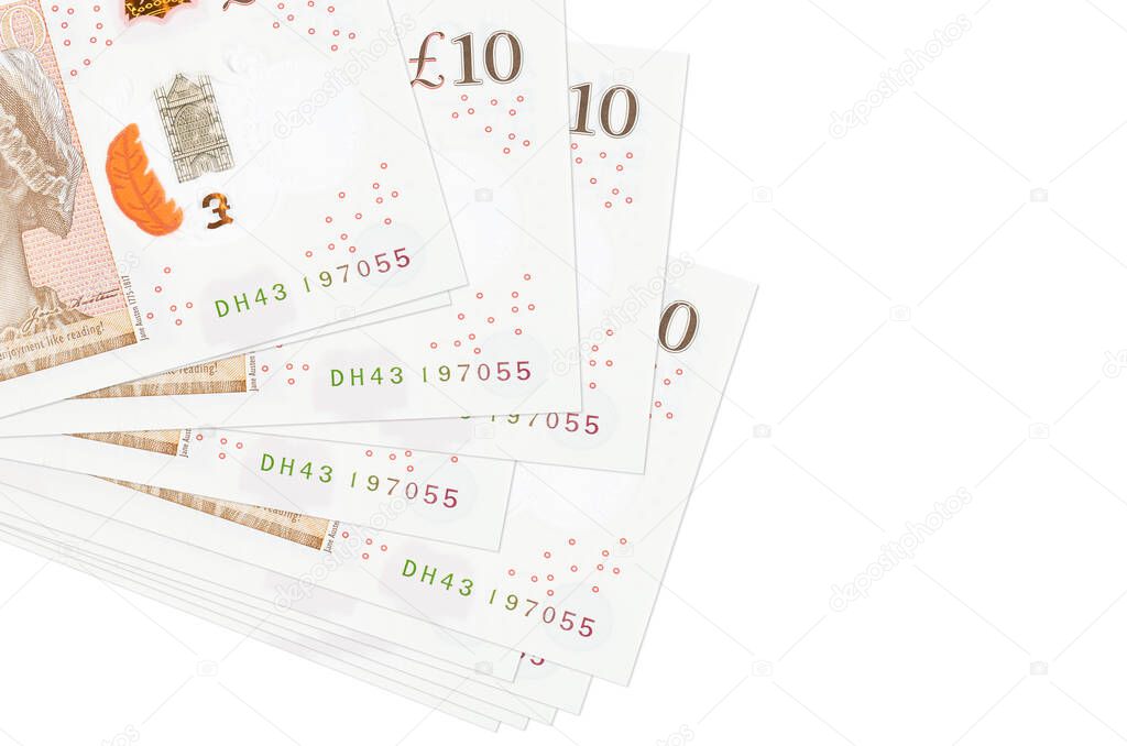 10 British pounds bills lies in small bunch or pack isolated on white. Mockup with copy space. Business and currency exchange concept