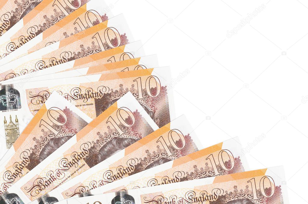 10 British pounds bills lies isolated on white background with copy space stacked in fan close up. Payday time concept or financial operations