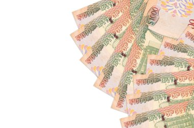 1000 Guyanese dolarlık banknotlar beyaz arka planda fotokopi alanı ile izole bir şekilde duruyor. Zengin yaşam kavramsal geçmişi. Büyük miktarda ulusal para birimi zenginliği