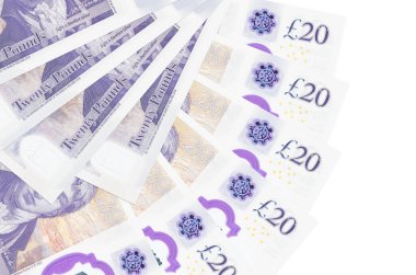 20 İngiliz sterlinlik banknotlar beyaz arka planda izole edilmiş, fotokopi alanı da yakın planda. Finansal işlemler kavramı