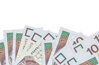 Ekranın alt tarafında 10 Polonyalı zloti banknotu var. Beyaz arka planda izole edilmiş ve fotokopi alanı var. Paralı iş kavramları için arkaplan afişi şablonu
