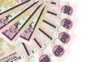 20 Sri Lanka rupi banknotları beyaz arka planda izole edilmiş, fotokopi alanı da yakın planda. Finansal işlemler kavramı