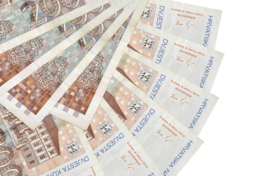 200 Croatian kuna bills lies isolated on white background with copy space stacked in fan shape close up. Financial transactions concept clipart