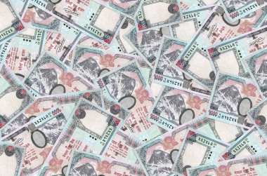 1000 Nepal rupisi büyük bir yığın halinde duruyor. Zengin yaşam kavramsal geçmişi. Büyük miktarda para.