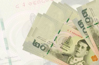 20 Tayland Baht faturası büyük yarı şeffaf banknotun arka planında duruyor. Ulusal para biriminin soyut sunumu. İş konsepti