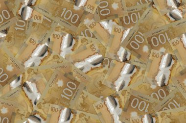 100 Canadian dollars bills lies in big pile. Rich life conceptual background. Big amount of money clipart