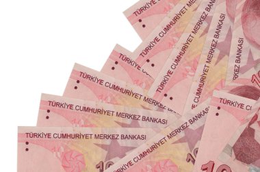 10 Türk lirası, beyaza izole edilmiş olarak farklı bir sırayla yatar. Yerel bankacılık ya da para kazanma konsepti. İş arkaplanı afişi