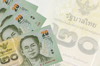 20 Tayland Baht faturası büyük yarı şeffaf banknotun arka planında duruyor. Kopyalama alanı olan soyut iş arkaplanı