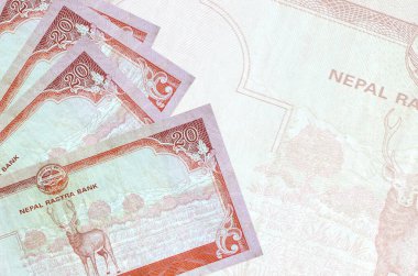 20 Nepal Rupisi banknotları büyük yarı şeffaf banknotların arka planında duruyor. Kopyalama alanı olan soyut iş arkaplanı