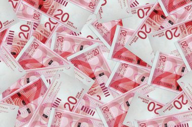 20 İsrailli yeni şekel banknot büyük bir yığın halinde duruyor. Zengin yaşam kavramsal geçmişi. Büyük miktarda para.