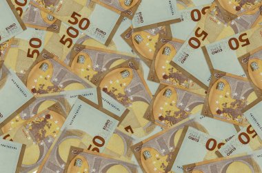 50 Euro 'luk banknotlar yığınla var. Zengin yaşam kavramsal geçmişi. Büyük miktarda para.