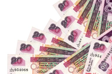 20 Sri Lanka rupisi banknotları beyaza izole edilmiş farklı bir sırayla yatar. Yerel bankacılık ya da para kazanma konsepti. İş arkaplanı afişi