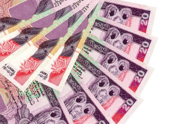 20 Sri Lanka rupi banknotları beyaz arka planda izole edilmiş, fotokopi alanı da yakın planda. Finansal işlemler kavramı