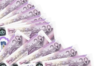 20 İngiliz sterlinlik banknotlar beyaz arka planda izole edilmiş, fotokopi alanı da pervaneye yakın duruyor. Maaş zamanı kavramı veya finansal işlemler