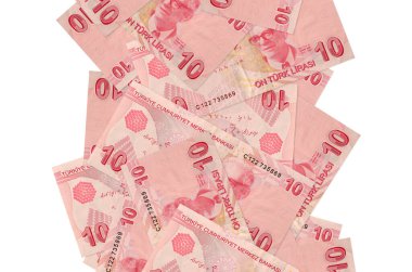 10 Türk lirası beyazın üzerinde izole bir şekilde uçuyor. Birçok banknot sol ve sağ tarafta beyaz kopya alanı ile düşüyor
