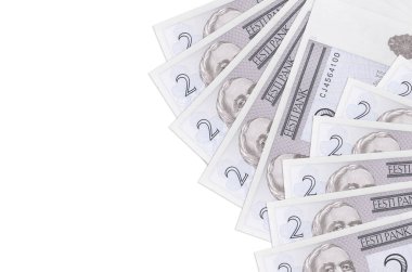 İki Estonya kroon banknotu beyaz arka planda fotokopi alanı ile izole edilmiş olarak yatar. Zengin yaşam kavramsal geçmişi. Büyük miktarda ulusal para birimi zenginliği