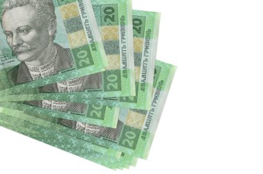 20 Ukrayna hrivniası banknotları küçük gruplar halinde yatar ya da beyazın üzerine izole edilmiş paketler halinde. Kopyalama alanı olan bir model. İş ve para değişimi kavramı
