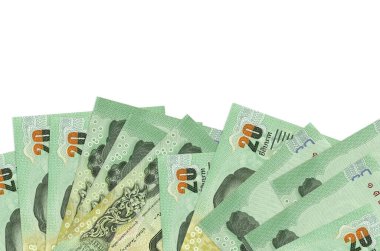 Ekranın alt tarafında 20 Tayland Baht banknotu var. Beyaz arka planda izole edilmiş ve fotokopi alanı var. Paralı iş kavramları için arkaplan afişi şablonu