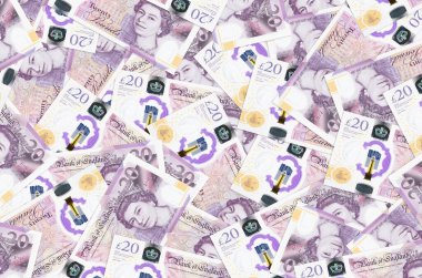 20 İngiliz sterlinlik banknotlar yığınla var. Zengin yaşam kavramsal geçmişi. Büyük miktarda para.