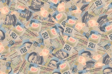 20 Meksika pezosu büyük bir yığın halinde duruyor. Zengin yaşam kavramsal geçmişi. Büyük miktarda para.