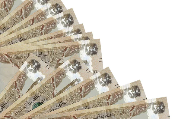 200 BAE dirhem banknotu beyaz arka planda izole bir şekilde duruyor. Fan kapağında da fotokopi alanı var. Maaş zamanı kavramı veya finansal işlemler