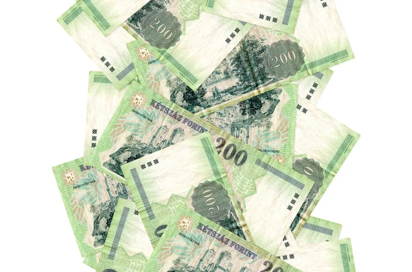 Beyaz üzerine izole edilmiş 200 Macar forint banknotu geliyor. Birçok banknot sol ve sağ tarafta beyaz kopya alanı ile düşüyor